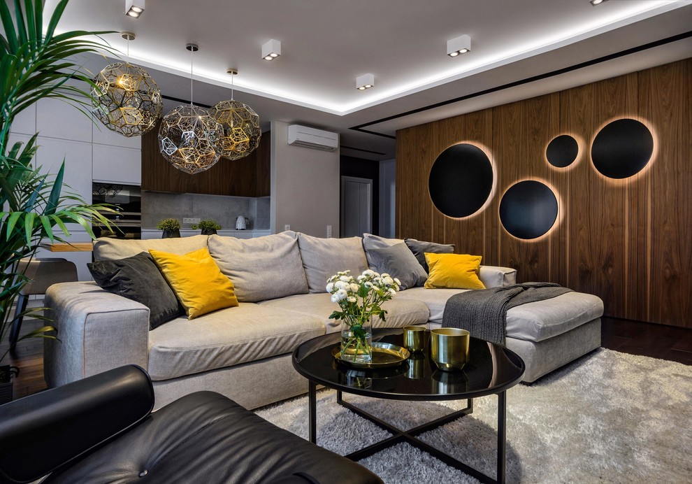 Foto di un soggiorno minimal aperto con sala formale, pareti grigie, parquet scuro e pavimento marrone