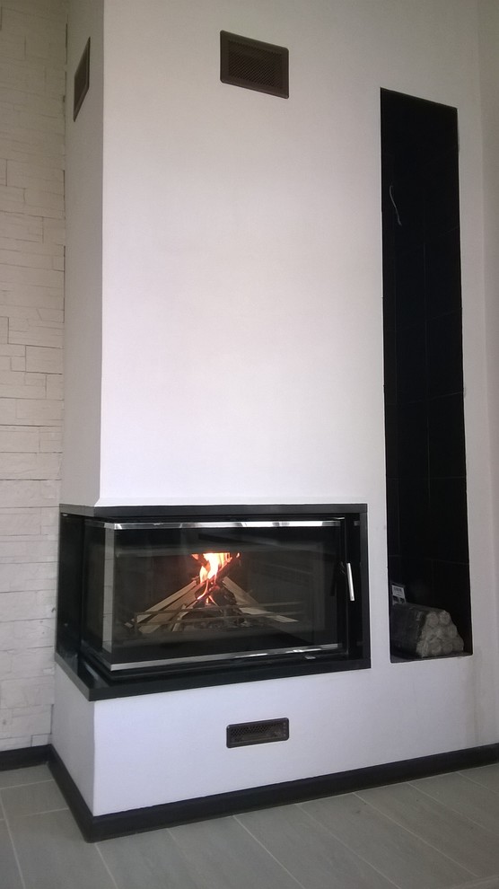 Example of a trendy living room design in Other with a corner fireplace