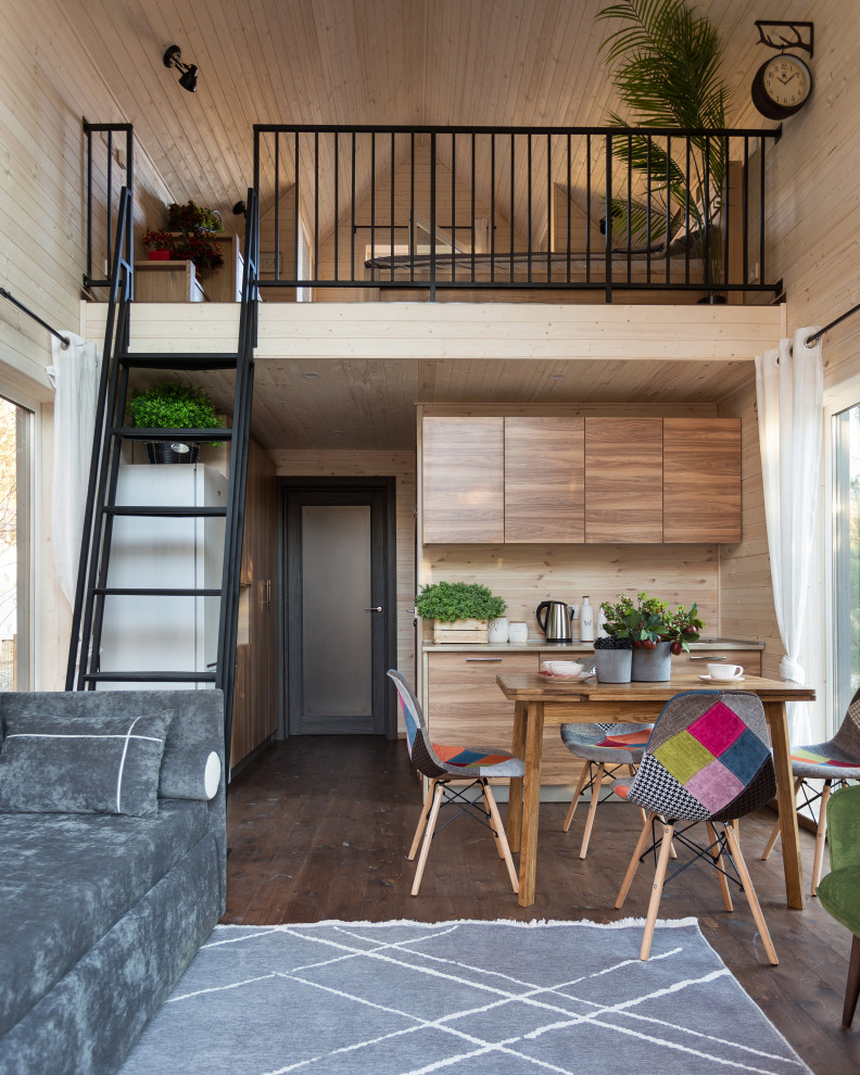 Foto di un piccolo soggiorno nordico stile loft con pareti bianche e pavimento marrone