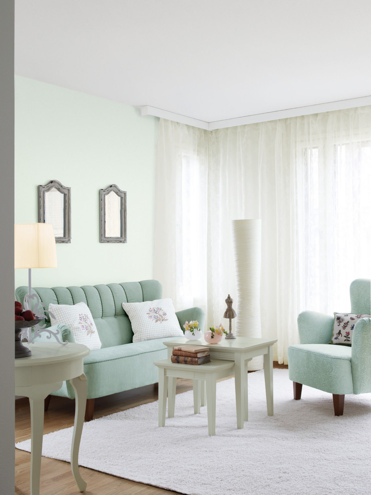Foto di un soggiorno design di medie dimensioni con pareti verdi, moquette, nessun camino e nessuna TV