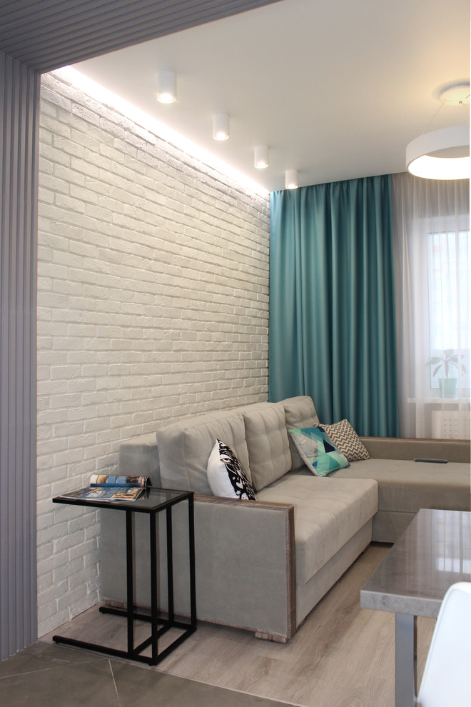 Inspiration för ett mellanstort skandinaviskt vardagsrum, med grå väggar, laminatgolv och beiget golv