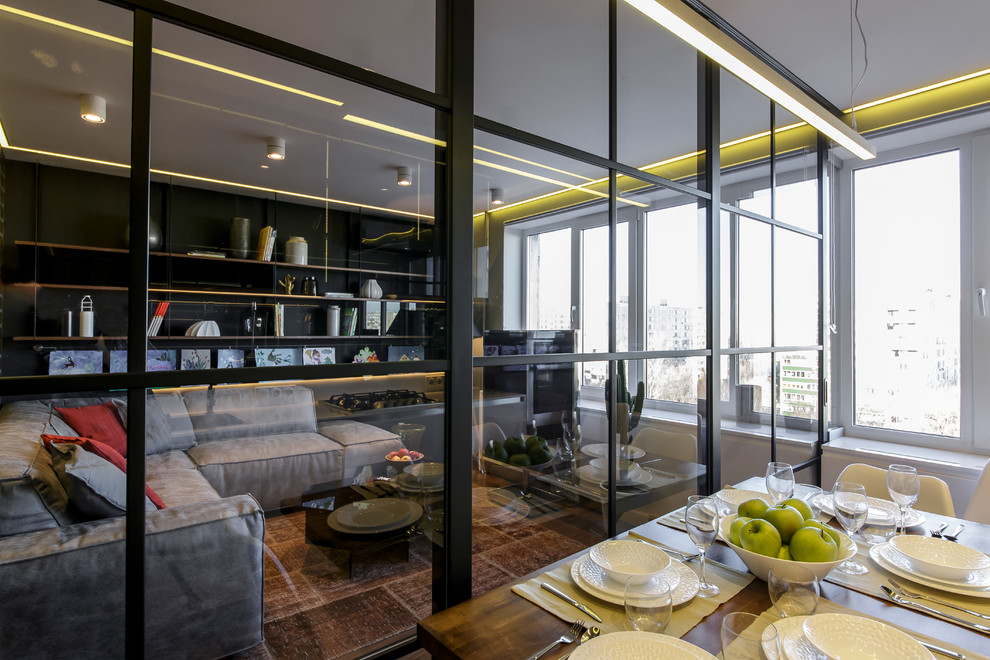 Living room - mid-sized contemporary formal and enclosed living room idea in Moscow with black walls and a tv stand