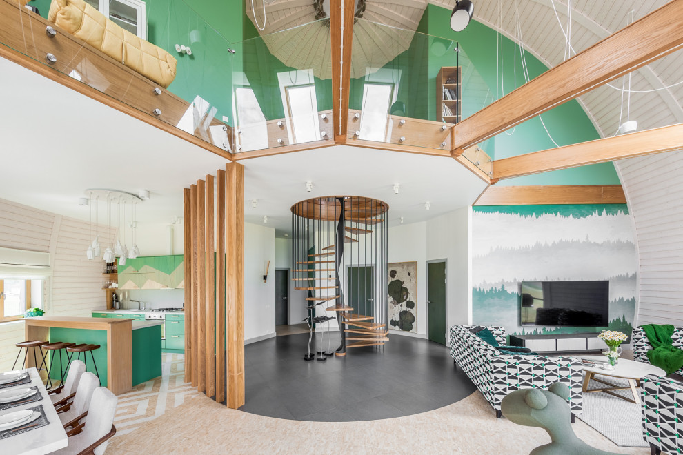 Пример оригинального дизайна: парадная, открытая гостиная комната в современном стиле с зелеными стенами и телевизором на стене