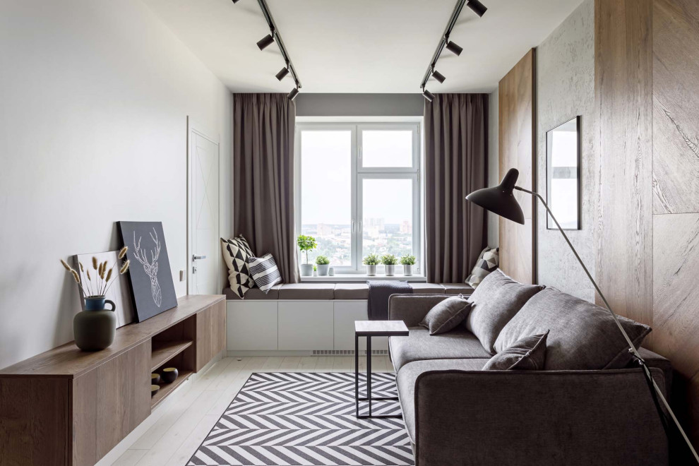 Стильный дизайн: гостиная комната в скандинавском стиле с белыми стенами и светлым паркетным полом без камина, телевизора - последний тренд