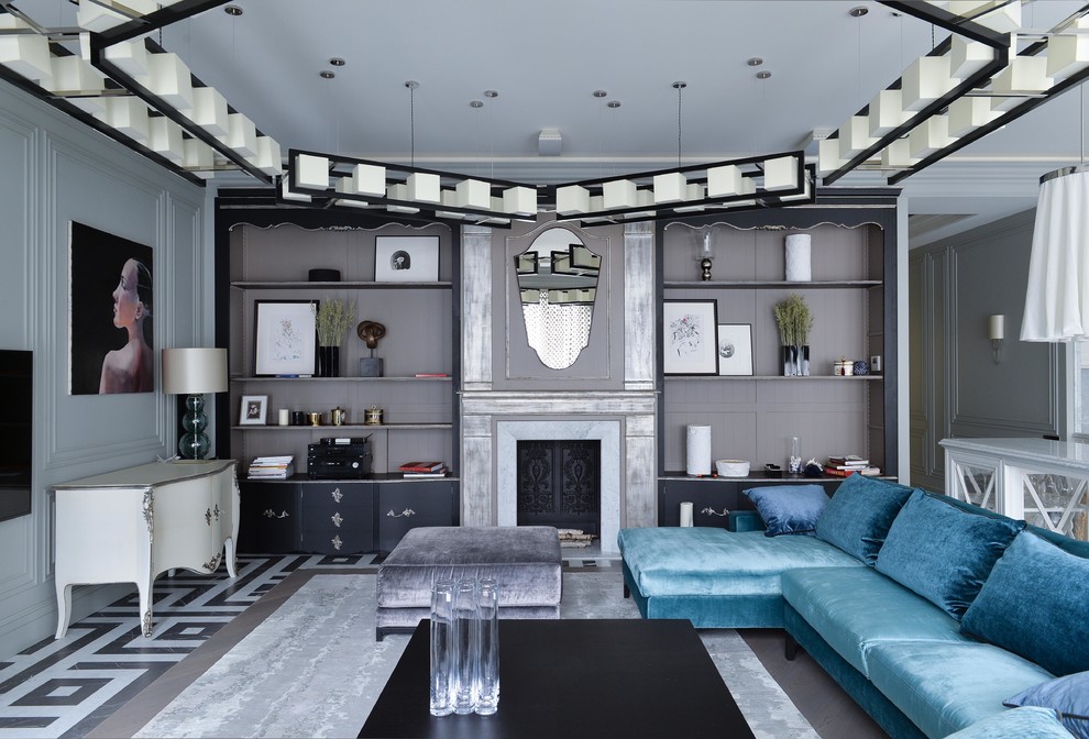 Diseño de salón para visitas abierto bohemio con paredes blancas, todas las chimeneas, televisor colgado en la pared y suelo gris