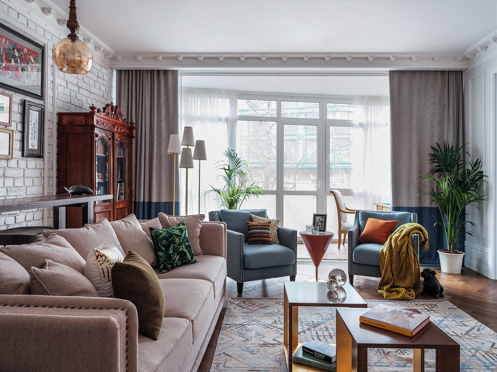 Large classic formal open plan living room in Moscow with white walls, medium hardwood flooring, a built-in media unit and feature lighting.