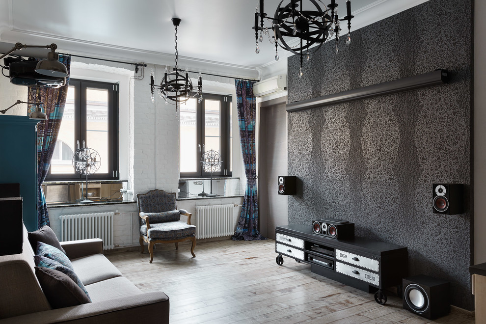 Eclectic living room in Saint Petersburg with black walls and light hardwood flooring.