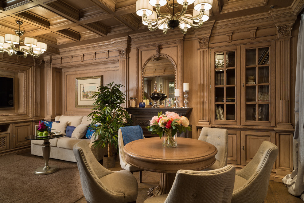 Пример оригинального дизайна: парадная гостиная комната в классическом стиле с коричневыми стенами, паркетным полом среднего тона, стандартным камином и телевизором на стене