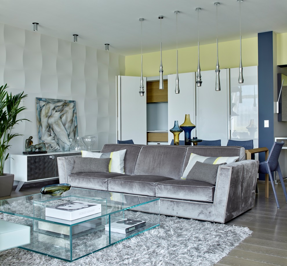 Esempio di un soggiorno design aperto con sala formale, parquet chiaro e pavimento beige