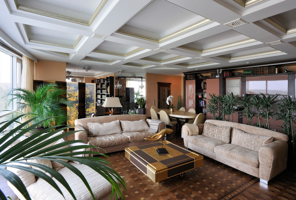 Пример оригинального дизайна: большая парадная, открытая гостиная комната в стиле неоклассика (современная классика) с оранжевыми стенами, паркетным полом среднего тона, коричневым полом и тюлем на окнах без камина
