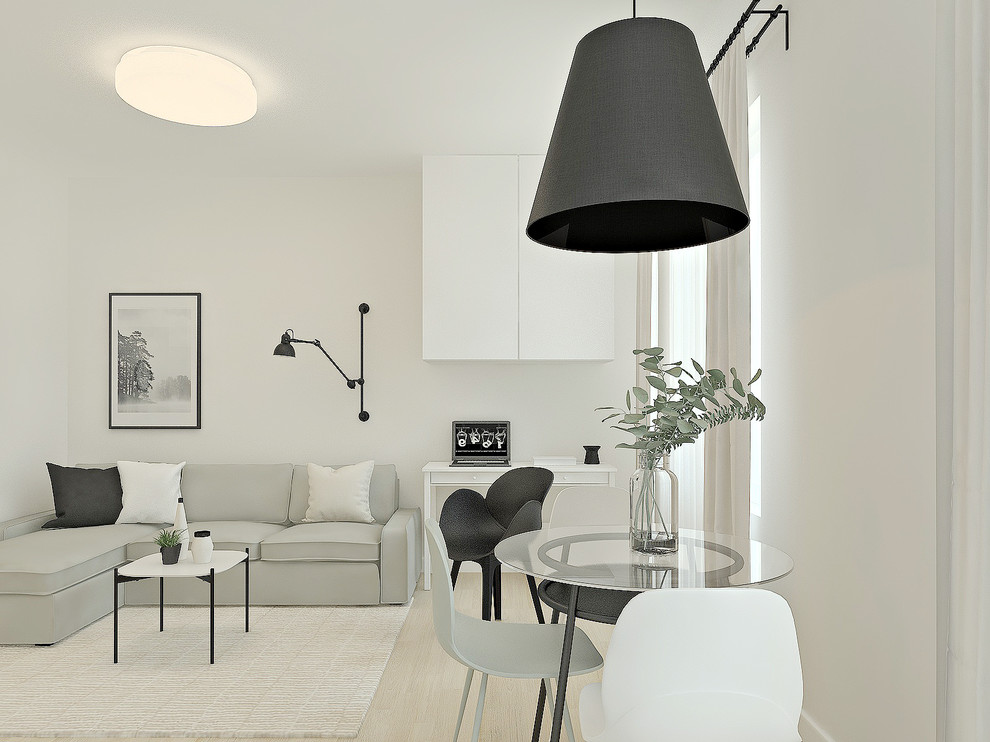 This is an example of a small scandi open plan living room in Other with white walls, laminate floors, a wall mounted tv and beige floors.