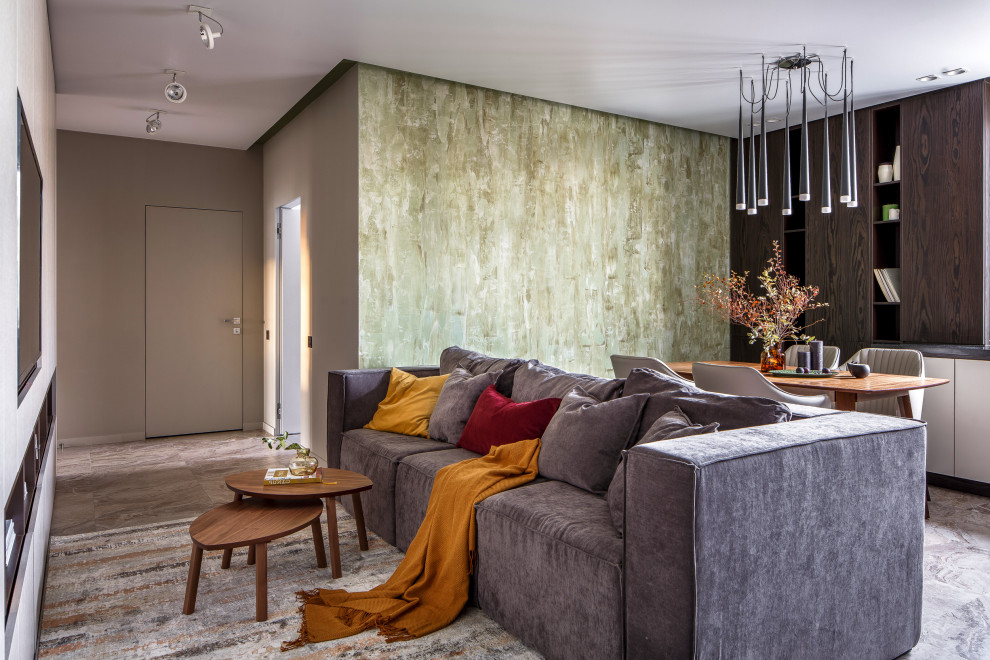 Идея дизайна: парадная, открытая, объединенная гостиная комната среднего размера в современном стиле с телевизором на стене