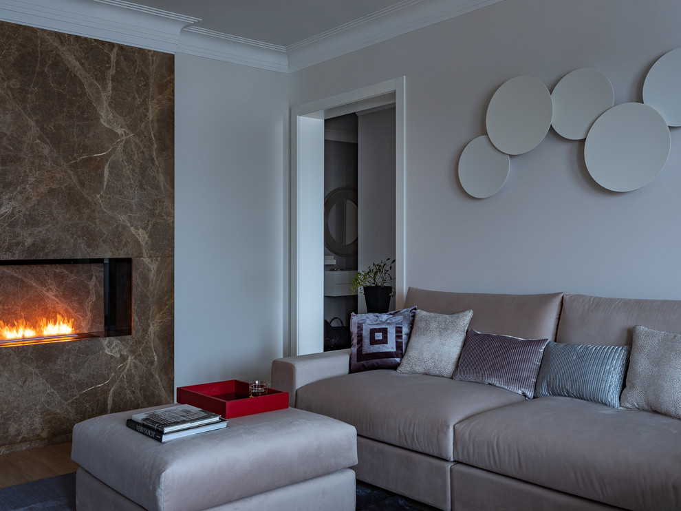 Example of a mid-sized transitional open concept medium tone wood floor living room design in Moscow with a ribbon fireplace, a stone fireplace and a wall-mounted tv
