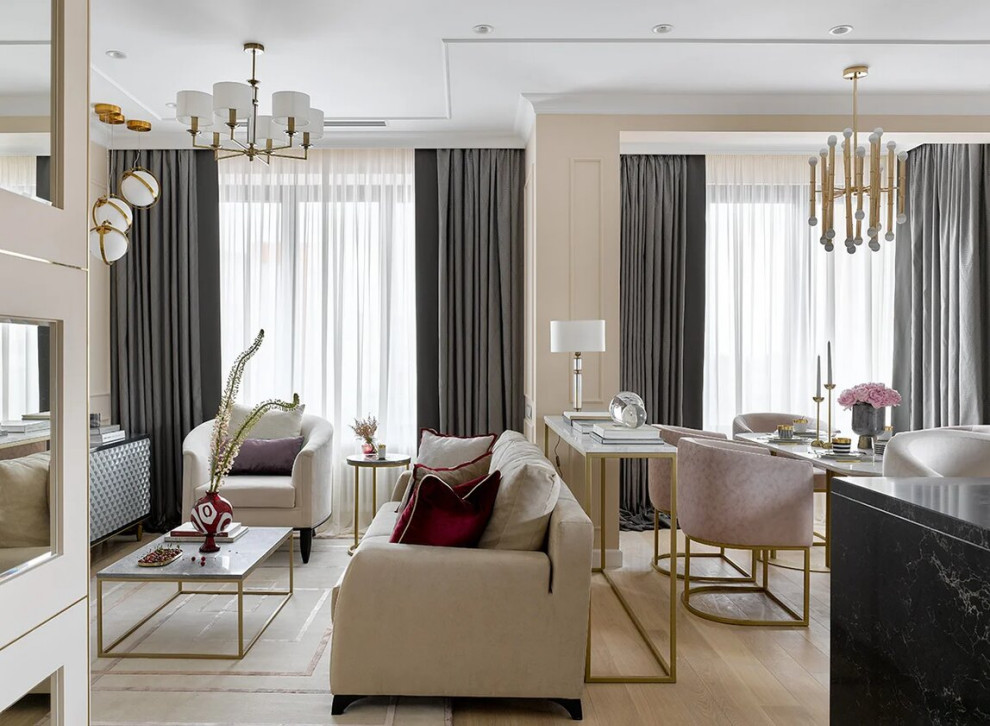 Contemporary open plan living room in Moscow with beige walls and light hardwood flooring.