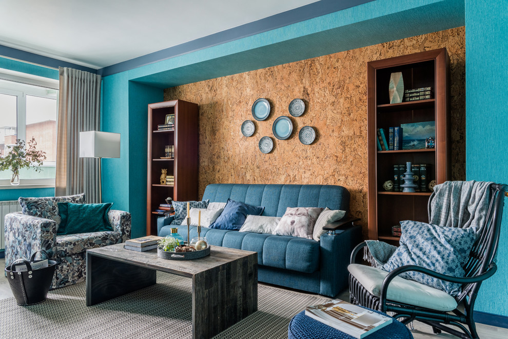 This is an example of a contemporary living room in Moscow with blue walls, carpet and grey floors.