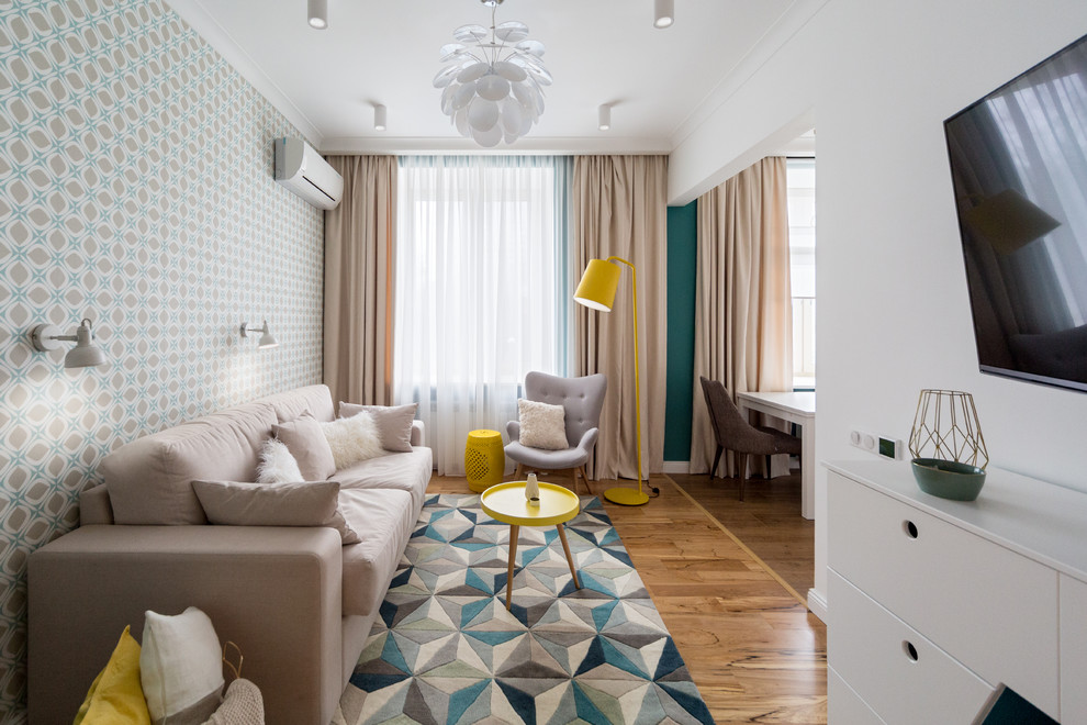 Ispirazione per un soggiorno scandinavo aperto con sala formale, pavimento in legno massello medio e TV a parete