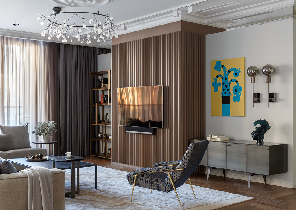 This is an example of a modern living room in Moscow with white walls, medium hardwood flooring, a wall mounted tv and brown floors.
