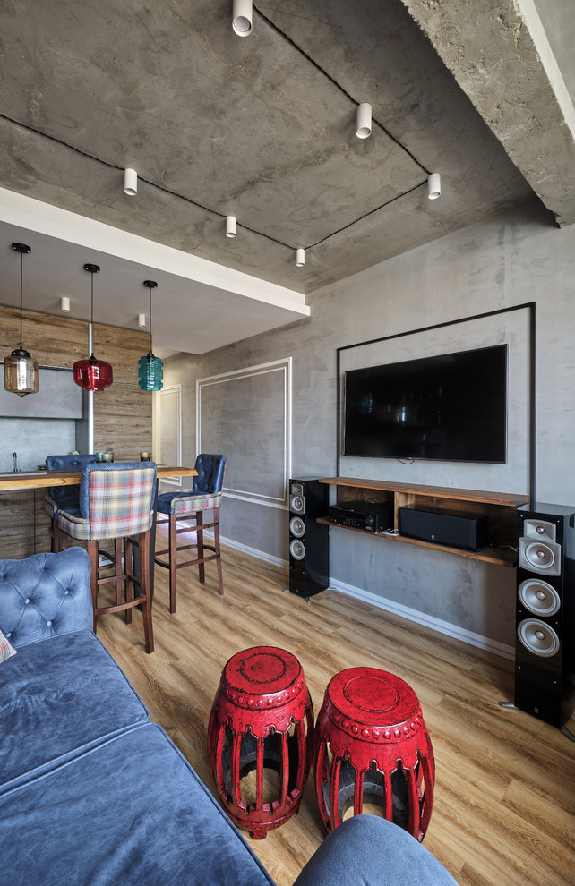 Small urban enclosed living room in Moscow with a home bar, multi-coloured walls, laminate floors, a wall mounted tv and beige floors.