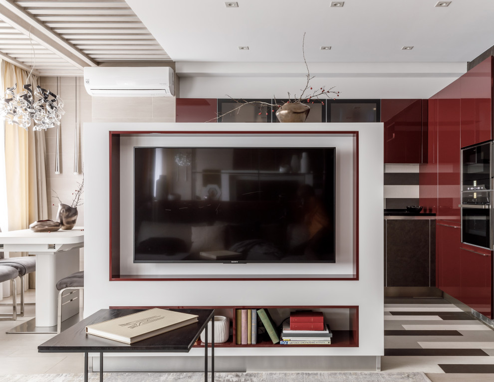 Стильный дизайн: открытая, объединенная гостиная комната в современном стиле с телевизором на стене - последний тренд