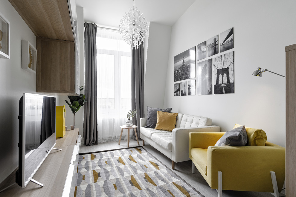 Ispirazione per un soggiorno scandinavo di medie dimensioni e stile loft con pareti bianche e pavimento in laminato