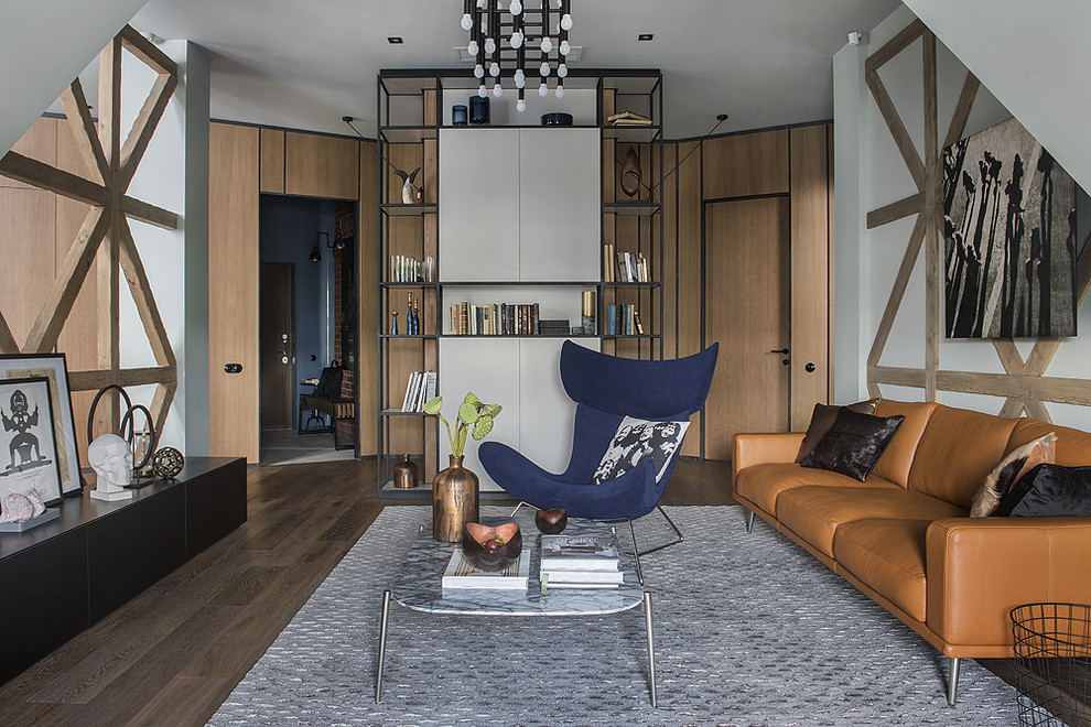 Идея дизайна: изолированная гостиная комната в стиле лофт с паркетным полом среднего тона, коричневым полом и белыми стенами