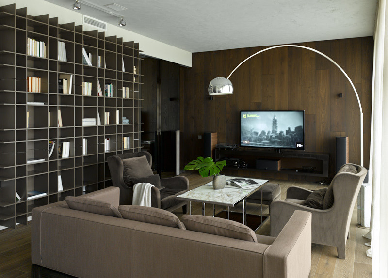 Источник вдохновения для домашнего уюта: большая гостиная комната в современном стиле с с книжными шкафами и полками, серыми стенами, темным паркетным полом, телевизором на стене, коричневым полом и деревянными стенами