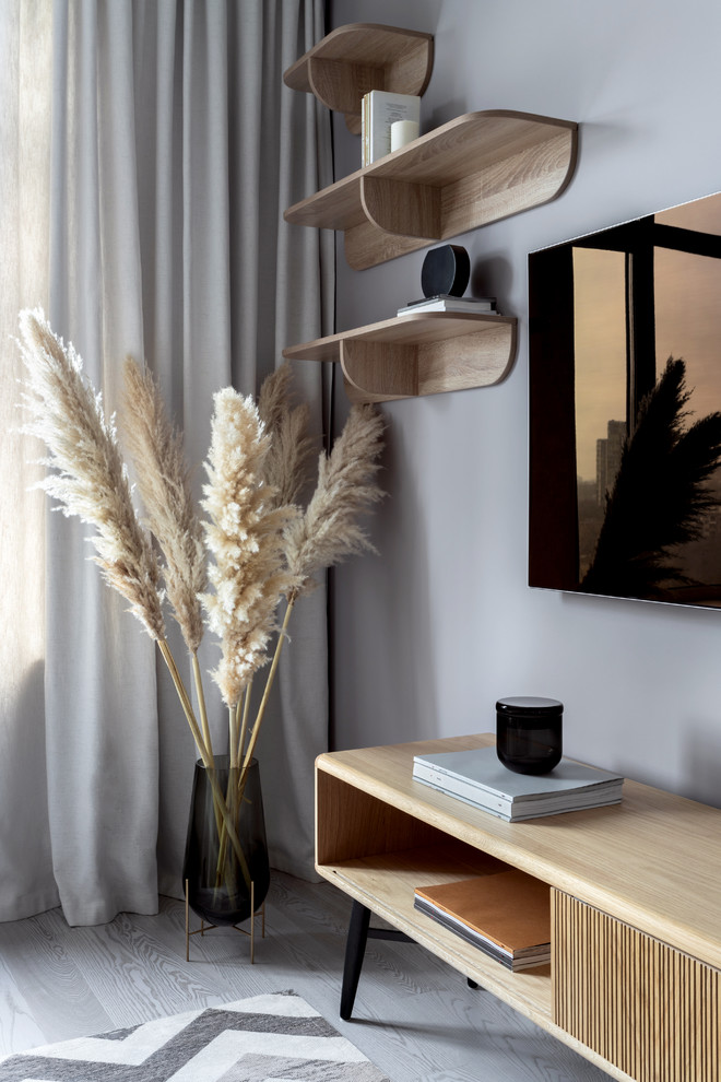 Idéer för att renovera ett mellanstort minimalistiskt vardagsrum, med grå väggar