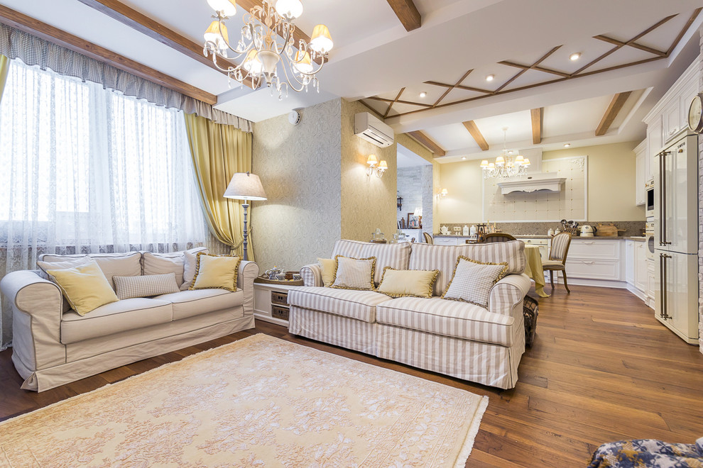 Esempio di un grande soggiorno classico aperto con sala formale, pareti beige e pavimento in legno massello medio