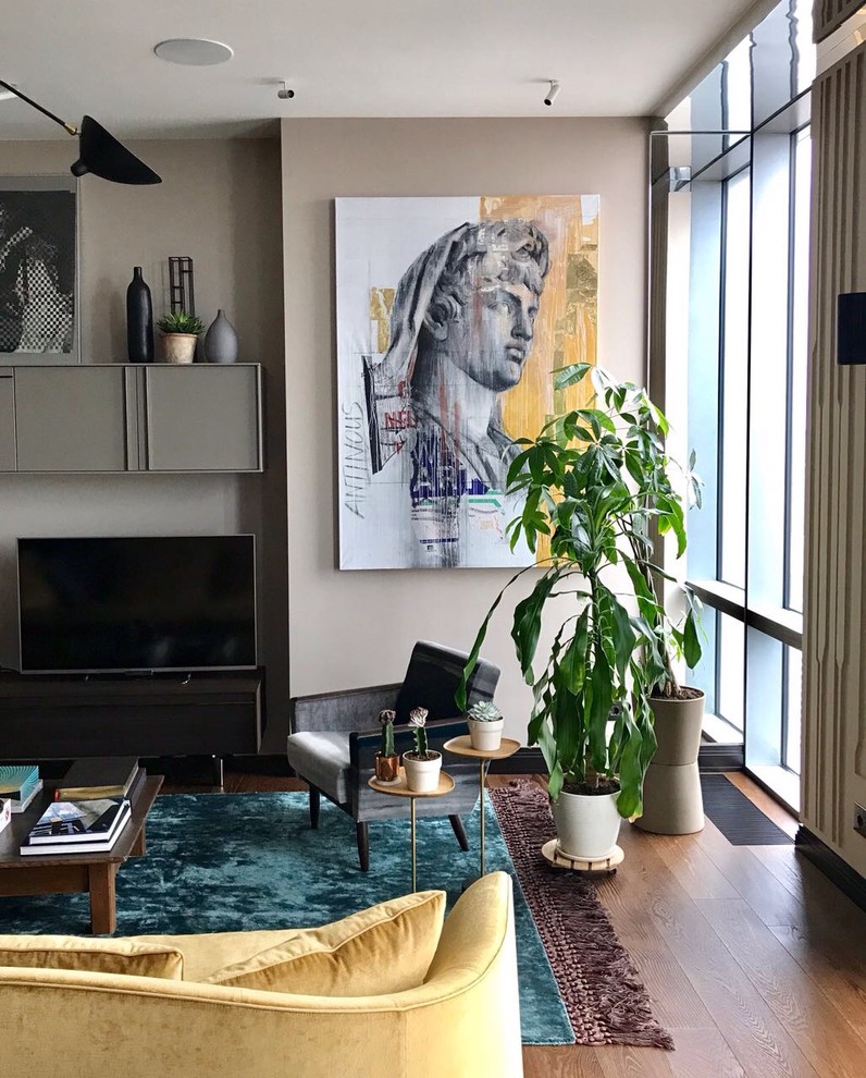 Foto di un grande soggiorno minimal aperto con sala formale, pareti marroni, pavimento in legno massello medio e parete attrezzata