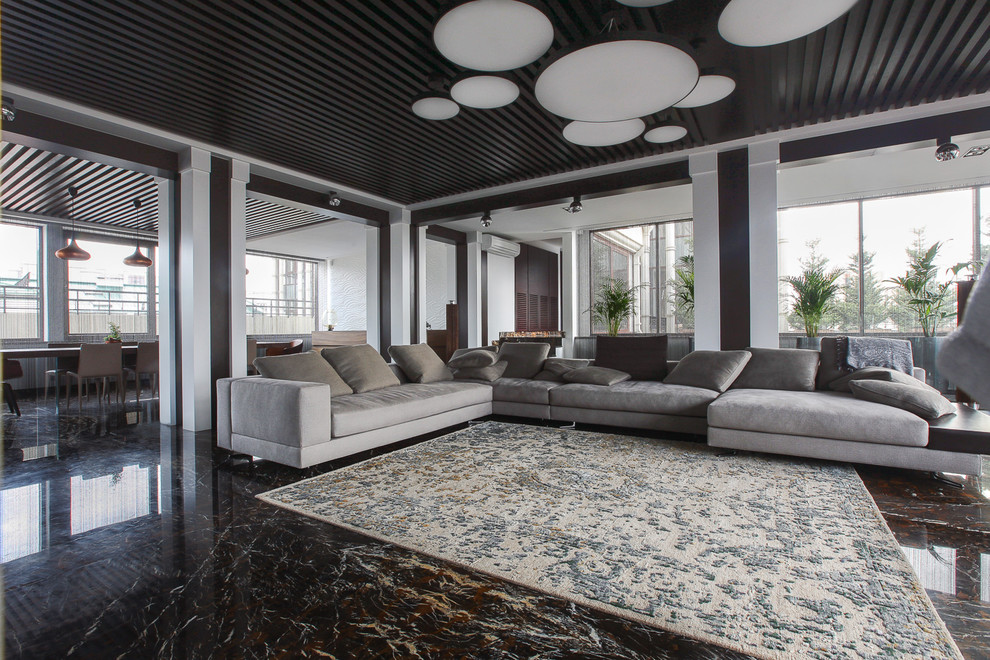 Idee per un soggiorno design con pavimento nero