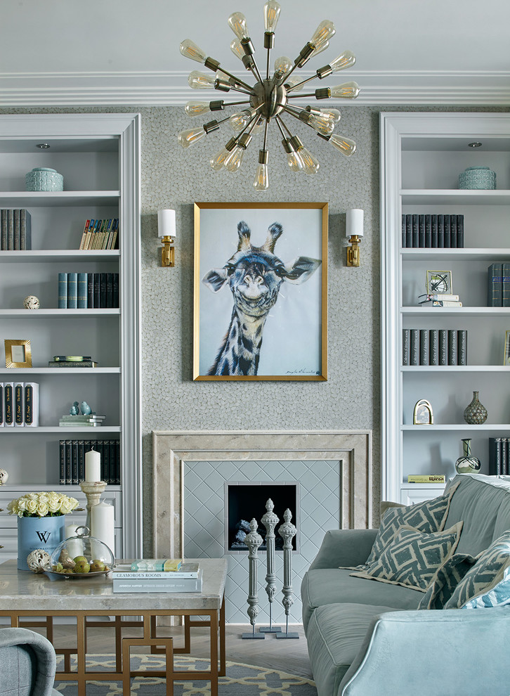 Design ideas for a medium sized traditional formal and grey and teal living room in Moscow with grey walls, a standard fireplace, a tiled fireplace surround and grey floors.