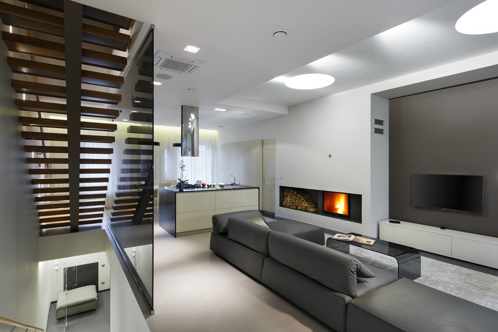 Trendy formal and open concept living room photo in Saint Petersburg with white walls, a standard fireplace, a wall-mounted tv and a metal fireplace