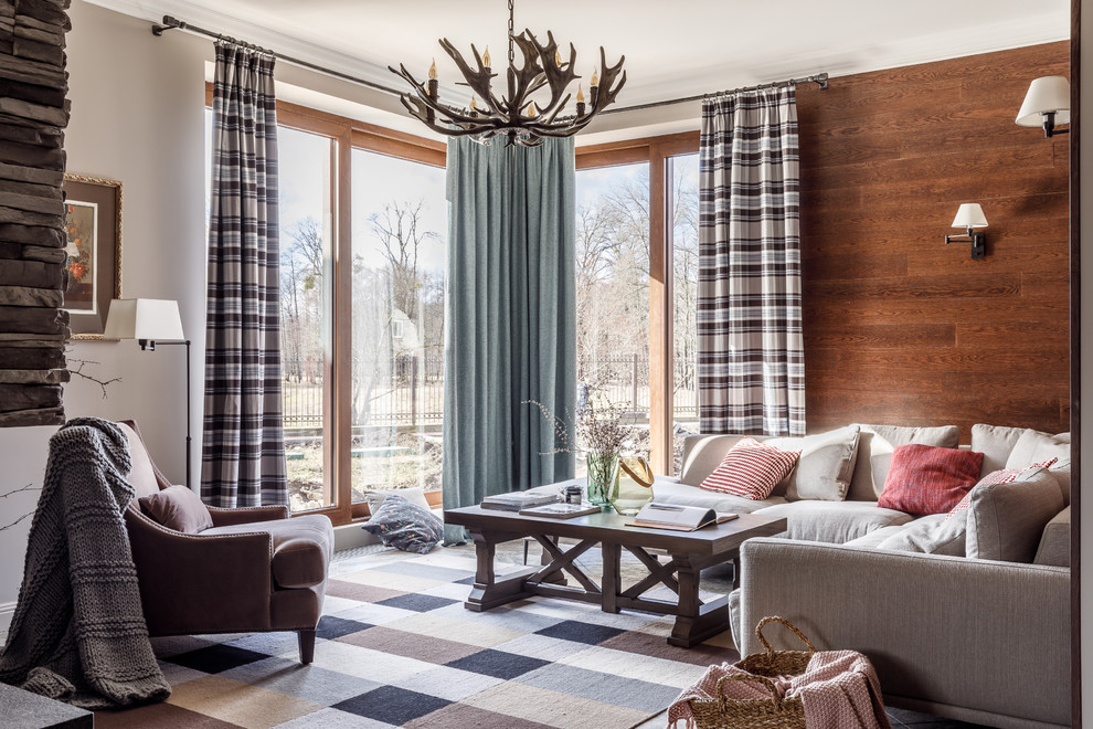 Immagine di un soggiorno tradizionale con sala formale, pareti marroni, moquette e pavimento multicolore