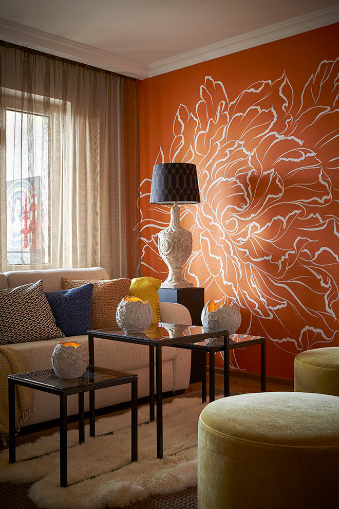 Bild på ett funkis separat vardagsrum, med ett finrum, orange väggar och heltäckningsmatta