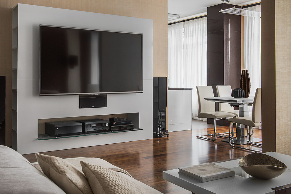 This is an example of a large contemporary open plan living room in Saint Petersburg with beige walls, dark hardwood flooring, no fireplace, brown floors and a wall mounted tv.