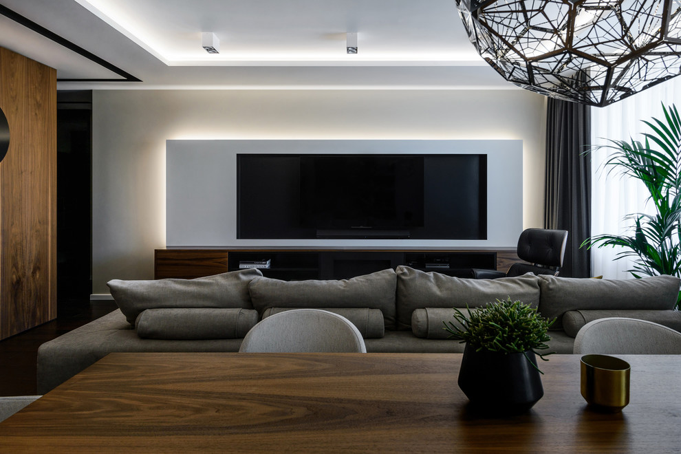 Idee per un soggiorno minimal con TV a parete