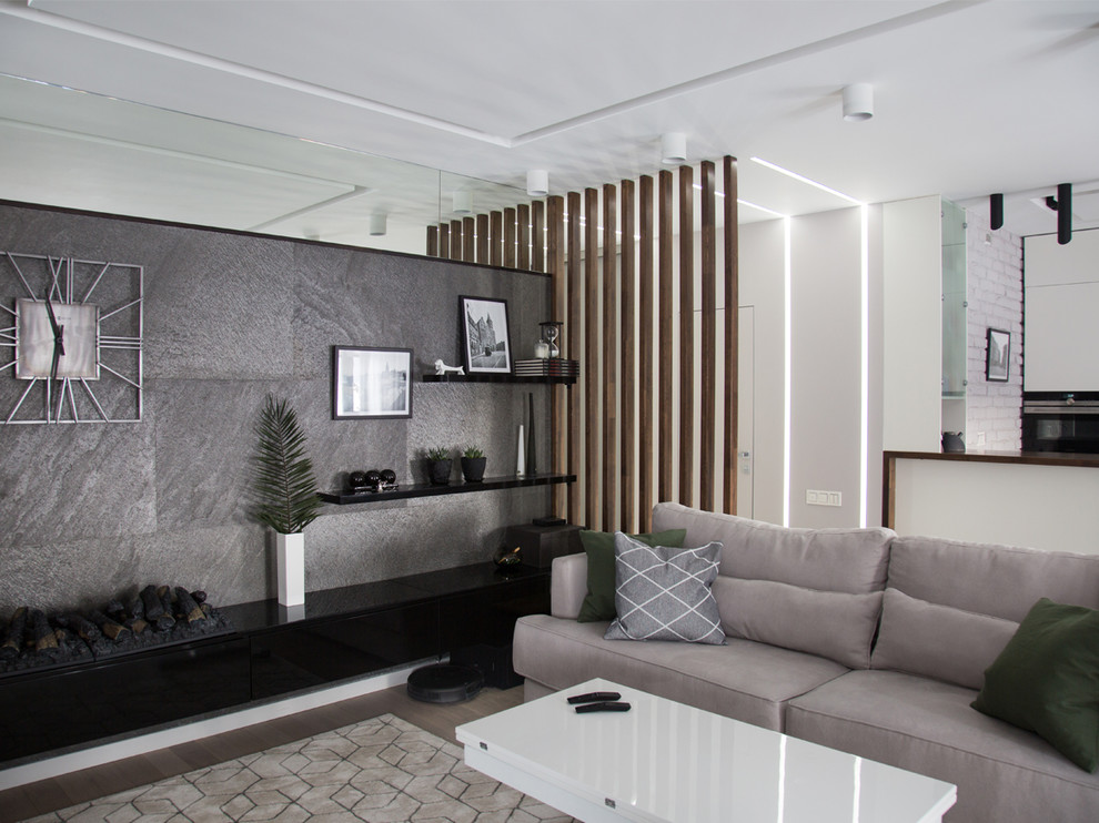 На фото: гостиная комната среднего размера в современном стиле