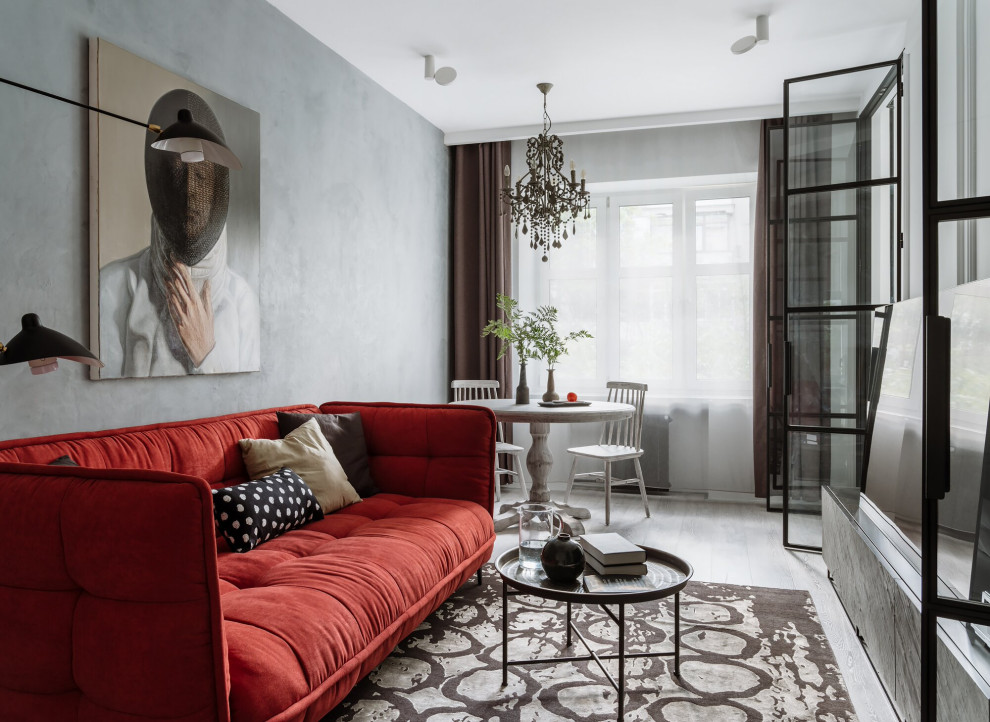 Photo of a scandinavian living room in Moscow with grey walls and grey floors.