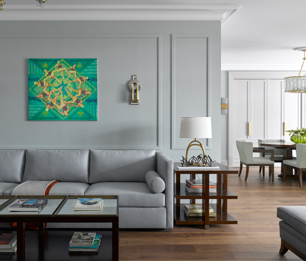 Immagine di un soggiorno design con sala formale, pareti grigie, pavimento in legno massello medio e pavimento marrone