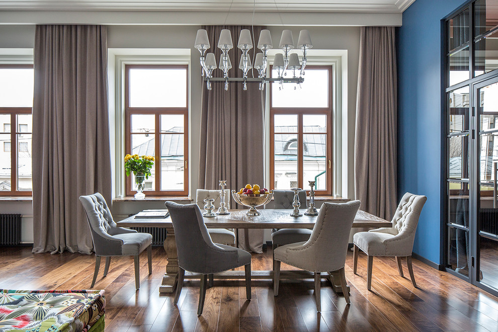 Inspiration for a classic dining room in Moscow with blue walls.