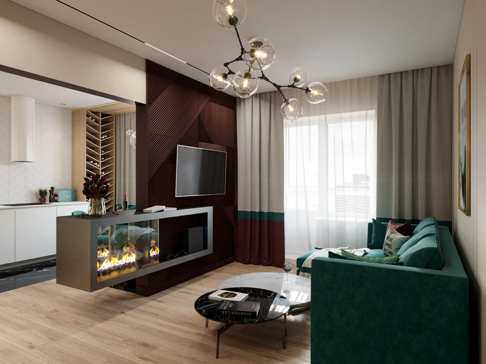 Пример оригинального дизайна: гостиная комната в современном стиле с светлым паркетным полом, двусторонним камином и телевизором на стене