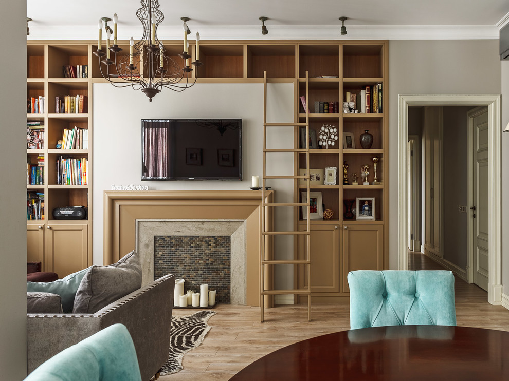 Example of a mid-sized classic open concept medium tone wood floor and beige floor living room library design in Moscow with gray walls, a wall-mounted tv, a ribbon fireplace and a wood fireplace surround
