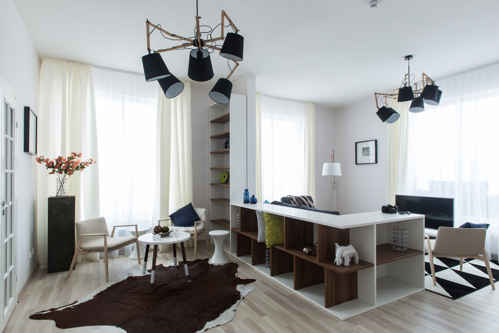 Design ideas for a scandi living room in Other with white walls and light hardwood flooring.