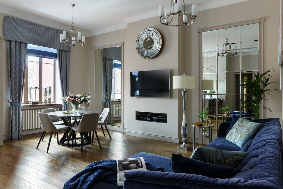 Large classic open plan living room in Saint Petersburg with beige walls and dark hardwood flooring.