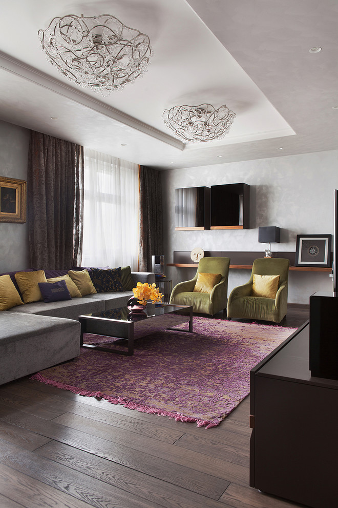 Esempio di un soggiorno design con sala formale, pareti grigie e parquet scuro