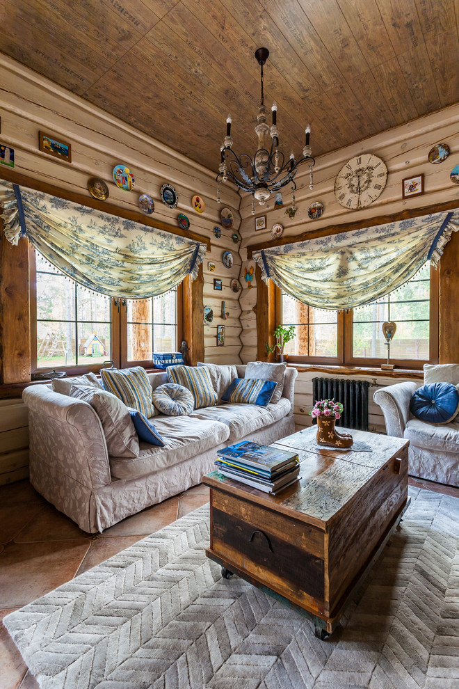 Idée de décoration pour un salon bohème avec un mur beige et moquette.