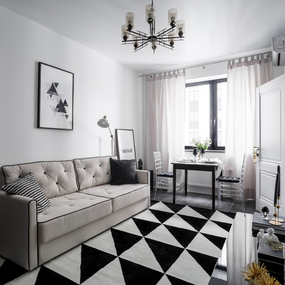 Imagen de salón cerrado clásico renovado pequeño sin televisor con paredes blancas, suelo laminado y suelo negro