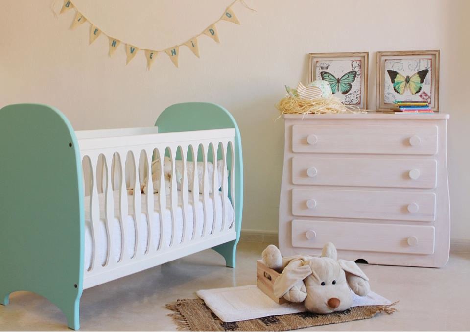 Inspiration for a medium sized scandinavian gender neutral nursery in Other with white walls.