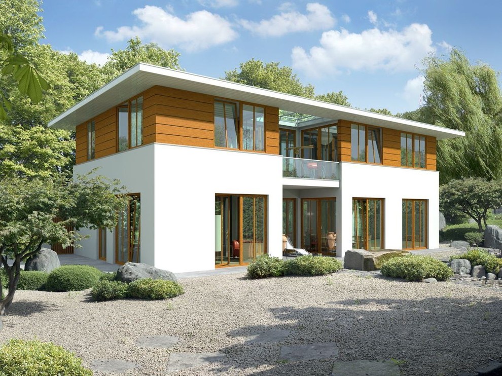 Пример оригинального дизайна: большой, двухэтажный дом в стиле модернизм с комбинированной облицовкой и плоской крышей