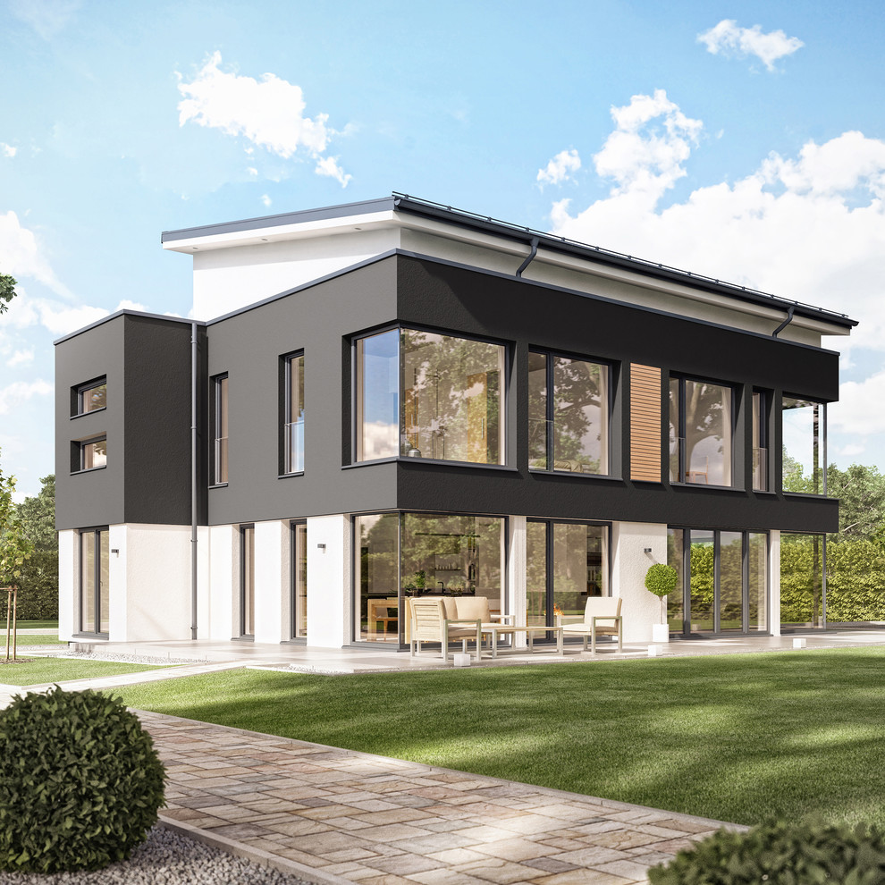 Großes, Dreistöckiges Modernes Einfamilienhaus mit Mix-Fassade, grauer Fassadenfarbe, Pultdach und Misch-Dachdeckung in Sonstige
